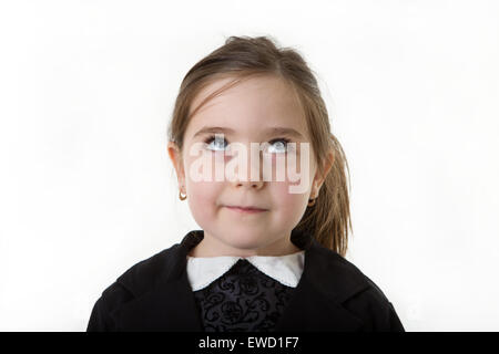 portrait of a young girl thinking looking up with her eyes Stock Photo