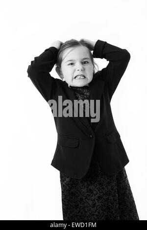 young girl dress up as a office worker getting mad pulling out her hair Stock Photo