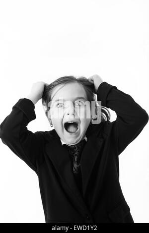 young girl dress up as a office worker getting mad pulling out her hair Stock Photo