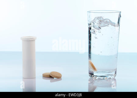 Fizzy pills,bottle and glass of water Stock Photo