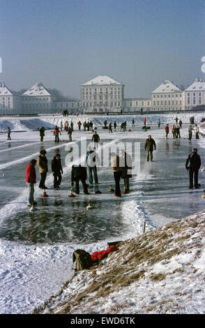 Curling on a frozen canal in front of Nymphenburg Palace in the Seventies.  Eisstockschützen auf dem Nymphenburger Kanal 1979 Stock Photo