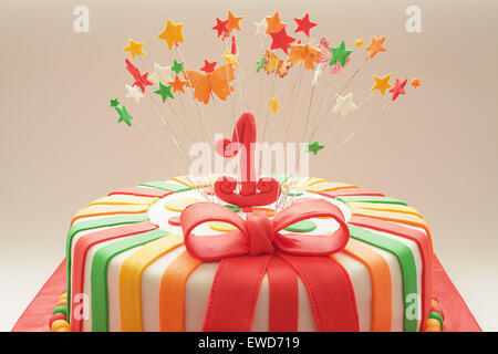Details of decoration of first year birthday cake, focus on number one. Stock Photo