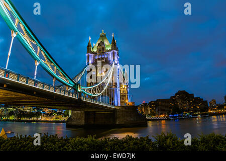 Bridge Tower night view from the bridge, London United Kingdom. A combined bascule and suspension bridge which crosses the River Stock Photo