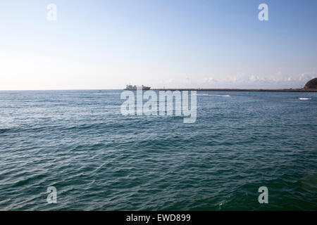 ship at entrance to Durban harbor, south Africa Stock Photo
