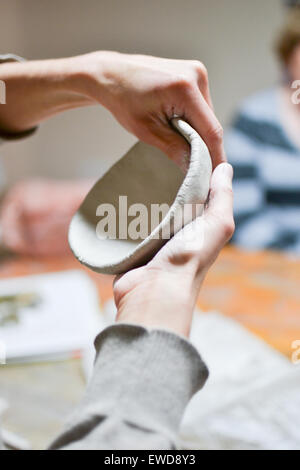 Close up of a woman making pottery Stock Photo