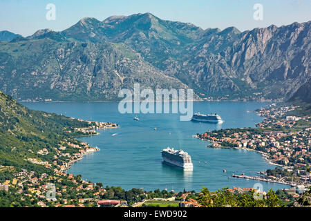 Montenegro,Kotor looking down onto the town and Bay of Kotor with cruise ships Regal Princess and Celebrity Silhouette moored off shore Stock Photo