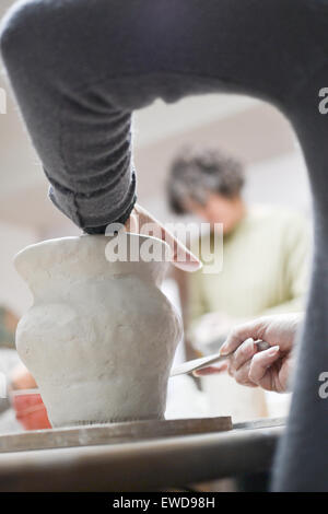 Close up of a woman making pottery Stock Photo