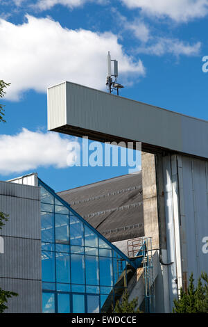 Old factory closeup with mobile mast in Oslo, Norway Stock Photo