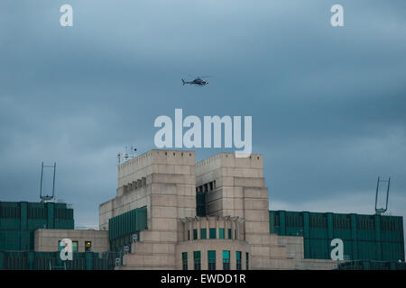 London, UK. 22 June, 2015. A helicopter flies over the MI6 building during filming of the new James Bond movie Spectre. Credit:  Pete Maclaine/Alamy Live News Stock Photo