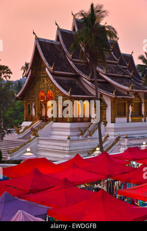 The HAW PHA BANG or Royal Temple sits above the famous NIGHT MARKET - LUANG PRABANG, LAOS Stock Photo