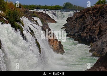 The TAM I DAENG WATERFALL is off the beaten track on the MEKONG RIVER in the 4 Thousand Islands Area (Si Phan Don) near DONE KHO Stock Photo