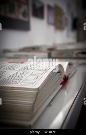 Extreme close-up of an open book, on blurred background. Stock Photo