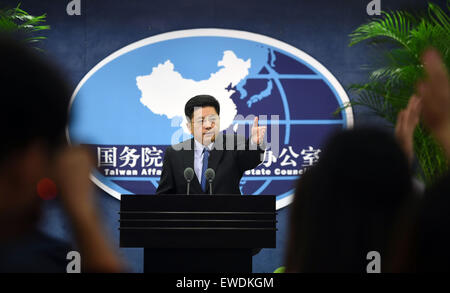 (150624) -- BEIJING, June 24, 2015 (Xinhua) -- Ma Xiaoguang, spokesman for the State Council Taiwan Affairs Office, gestures at a press conference in Beijing, capital of China, June 24, 2015. The Chinese mainland welcomes people from all walks of life in Taiwan, including veterans who fought the war and their relatives, to attend the mainland's commemoration of the 70th anniversary of the end of World War II. Ma Xiaoguang, spokesman for the State Council Taiwan Affairs Office, told the press conference that the victory in the Chinese People's War of Resistance against Japanese Aggression was ' Stock Photo