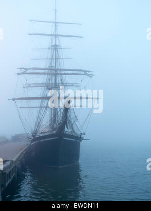 Ghostly sailing vessel in the mist.  Helsinki Stock Photo