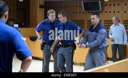 Prague, Czech Republic. 24th June, 2015. A Czech district court today released on parole David Berdych (second from right), head of the 'Berdych gang' who was sentenced to 15 years for robberies and kidnapping, after more than 11 years spent in prison, in Prague, Czech Republic, June 24, 2015. The case of the Berdych gang has been the largest organised crime case in the Czech Republic. Pictured right Berdych´s lawyer Jaroslav Ortman. (CTK Photo) © CTK/Alamy Live News Stock Photo