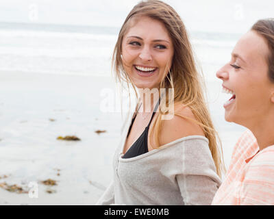 Two young women nude on a topless beach in the Seychelle Islands Stock