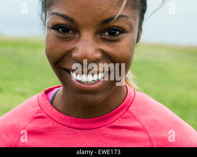 Portrait of a smiling young woman jogger Stock Photo