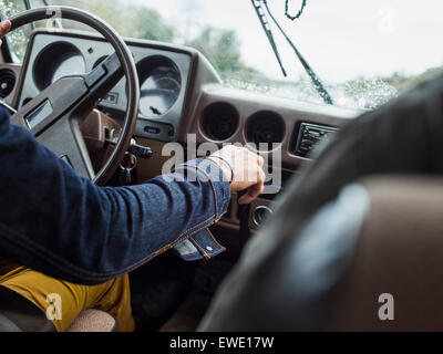 Young man in a car behind the steering wheel, driving Stock Photo