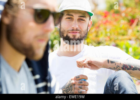 Portrait of two young men wearing sunglasses Stock Photo