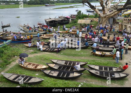 Boat makers display the wooden boat for sale at Kaikkarateke market , Narayanganj district in Bangladesh. On June 21, 2015 Stock Photo