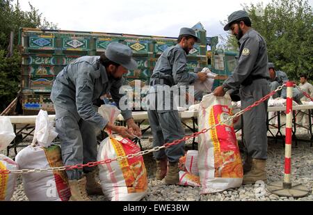 (150624) -- NANGARHAR, June 24, 2015 (Xinhua) -- Afghan policemen show seized drugs in Nangarhar province, eastern Afghanistan, June 24, 2015. Afghan policemen captured 370kg drugs with two drug smugglers during an operation in Nangarhar province on Wednesday. (Xinhua/Tahir Safi) (zjy) Stock Photo