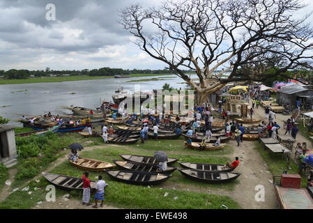 Boat makers display the wooden boat for sale at Kaikkarateke market , Narayanganj district in Bangladesh. On June 21, 2015 Stock Photo