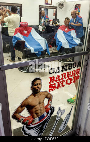 Miami Florida,Little Havana,Gamboa Barber Shop,Cuban flag,Hispanic man men male,cutting hair,customer,interior inside,FL150324014 Stock Photo