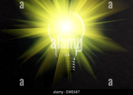 Halogen light bulb on dark background with light rays Stock Photo