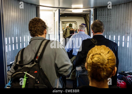 New York City,NY NYC,Queens,John F. Kennedy International Airport,JFK,interior inside,gate,ramp,passenger passengers rider riders,boarding,US Airways Stock Photo