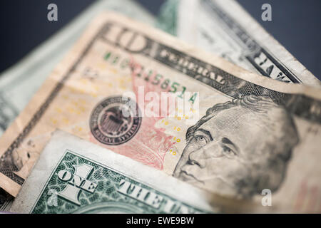 A US ten dollar bill with Alexander Hamilton is seen amongst other bills poking out of a wallet in New York on Thursday, June 18, 2015. The US Treasury Dept. announced that the 2020 redesign of the ten dollar bill will replace Alexander Hamilton with a woman. The change in the bill will occur on the 100th anniversary of the 19th Amendment giving women the right to vote. (© Richard B. Levine) Stock Photo