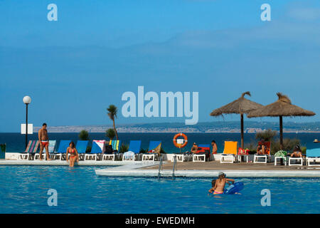 Swimming pool of Insotel Club Maryland, Migjorn beach, Formentera, Balears Islands, Spain. Holiday makers, tourists, Platja de Migjorn, simming pool, Formentera, Pityuses, Balearic Islands, Spain, Europe. Stock Photo