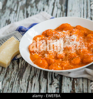 Gluten Free Gnocchi in tomato and tarragon sauce Stock Photo