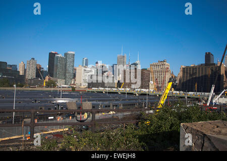 Stationary commuter trains waiting in The West Side Yard  of The Empire Connection from The High Line New York City USA Stock Photo