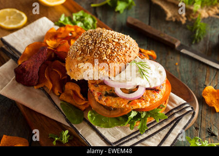 Homemade Organic Salmon Burger with Tartar Sauce Stock Photo