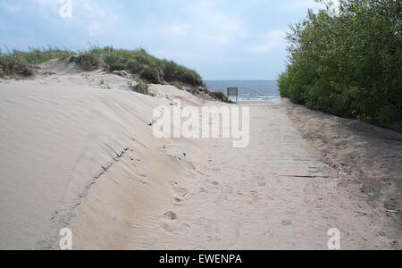 Pedestrian beach boardwalk with sand and sky in Halland, Sweden. Stock Photo