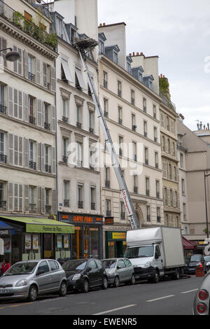 Street scene with a moving truck and elevated lift for moving personal possessions  in Paris, France Stock Photo