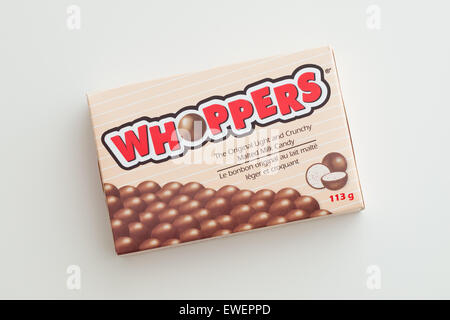 A box of Whoppers candy.  Whoppers are malted milk balls covered with chocolate and produced by the Hershey Company. Stock Photo