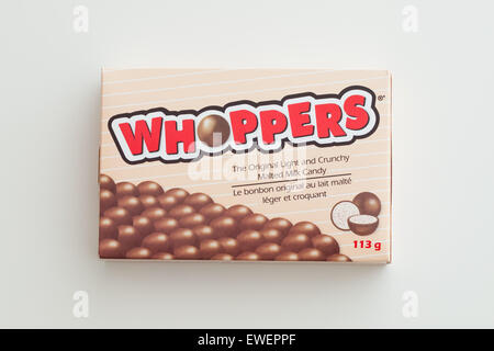 A box of Whoppers candy.  Whoppers are malted milk balls covered with chocolate and produced by the Hershey Company. Stock Photo