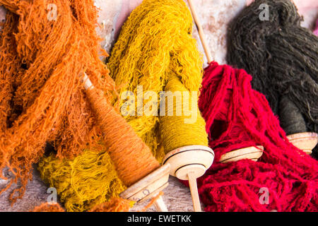 Spools of hand-dyed and spun wool at a local weaving centre in rural Peru. Stock Photo
