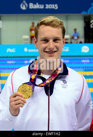 Baku, Azerbaijan. 25th June, 2015. Britain's Luke Greenbank displays his gold medal during the awarding ceremony for the men's 100m backstroke final at the European Games in Baku, Azerbaijan, June 24, 2015. Greenbank claimed the title of the event. © Xinhua/Alamy Live News Stock Photo