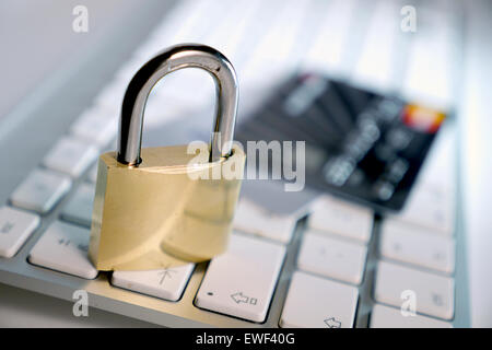 computer keyboard and lock with credit card Stock Photo