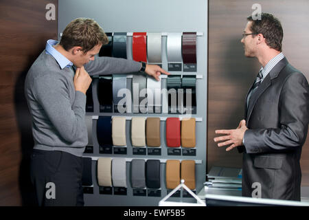 Salesperson showing color swatch to customer Stock Photo