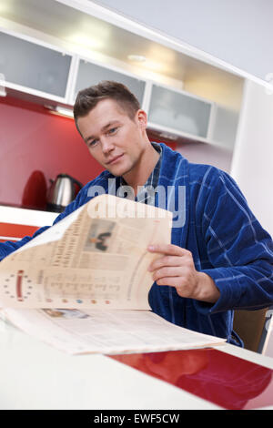 Man reading newspaper Stock Photo