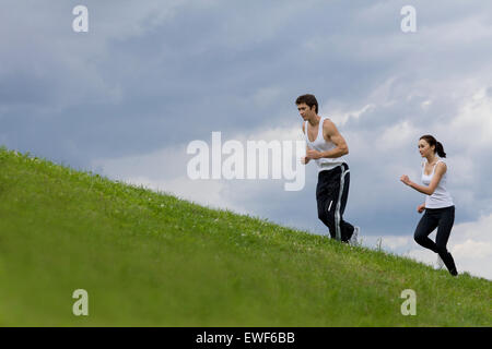 Young couple exercising in park Stock Photo