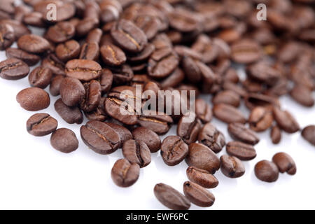 Rosted coffee grains on white backgorund Stock Photo