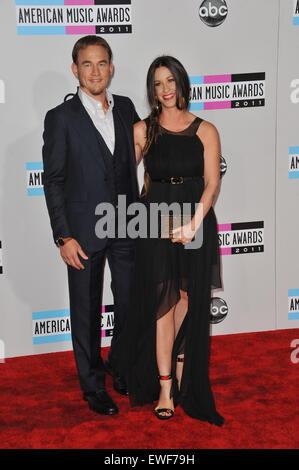 LOS ANGELES, CA - NOVEMBER 20, 2011: Alanis Morissette & Mario Treadway arriving at the 2011 American Music Awards at the Nokia  Stock Photo