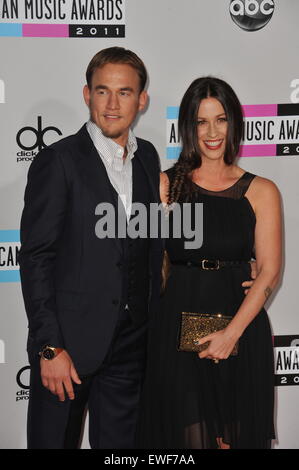 LOS ANGELES, CA - NOVEMBER 20, 2011: Alanis Morissette & Mario Treadway arriving at the 2011 American Music Awards at the Nokia  Stock Photo