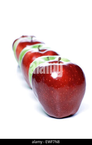 Close-up of apples in row on white background Stock Photo