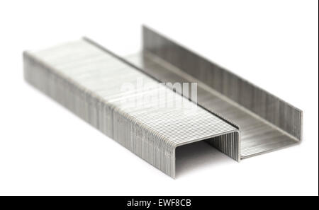 Staples. Closeup of a pair of strips of staples on a white background. Stock Photo
