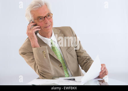 SENIOR WORKING Stock Photo
